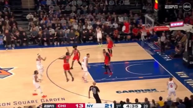 Knicks guard Josh Hart throws a pass over the head of Donte DiVincenzo and into the stands during a game vs. the Bulls.